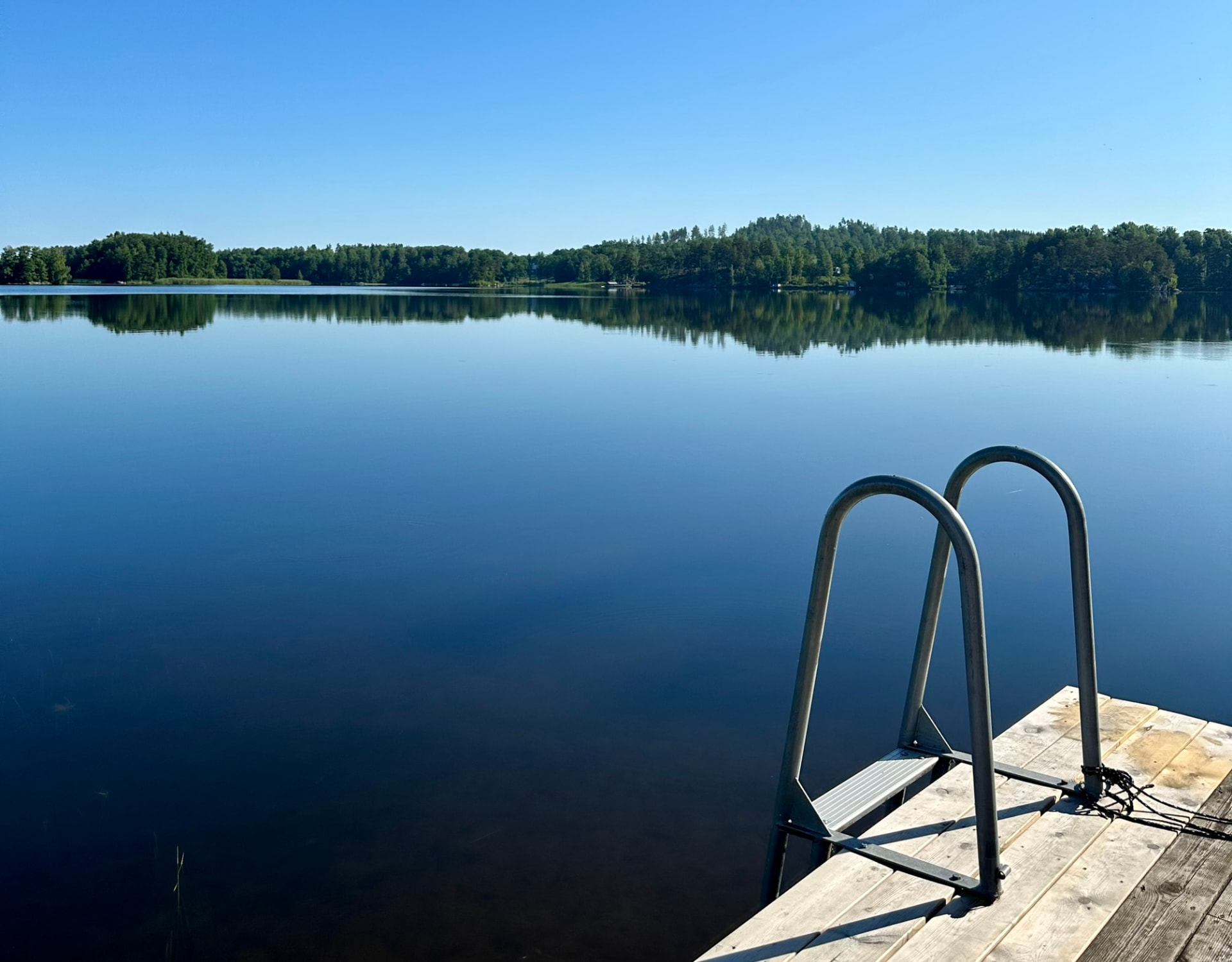The swimming ladder on the jetty and the still, wide water of Lake Bunn